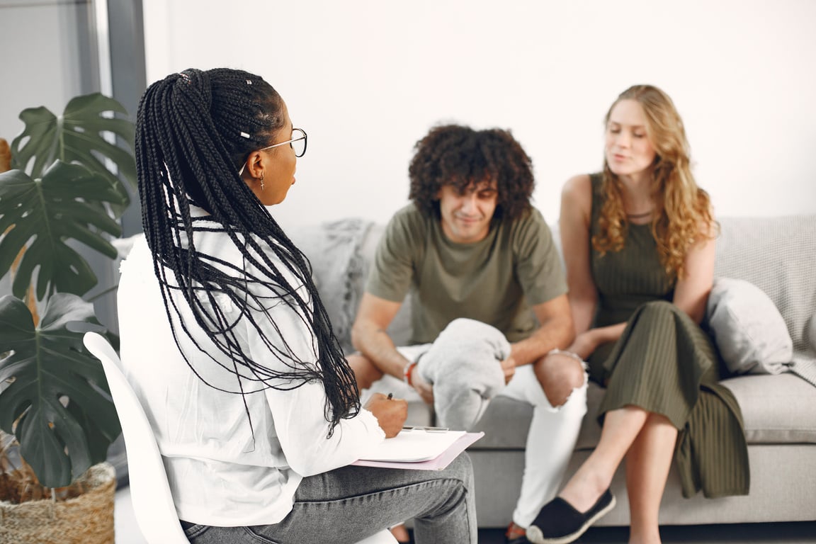 Couple Sitting in Therapist Office